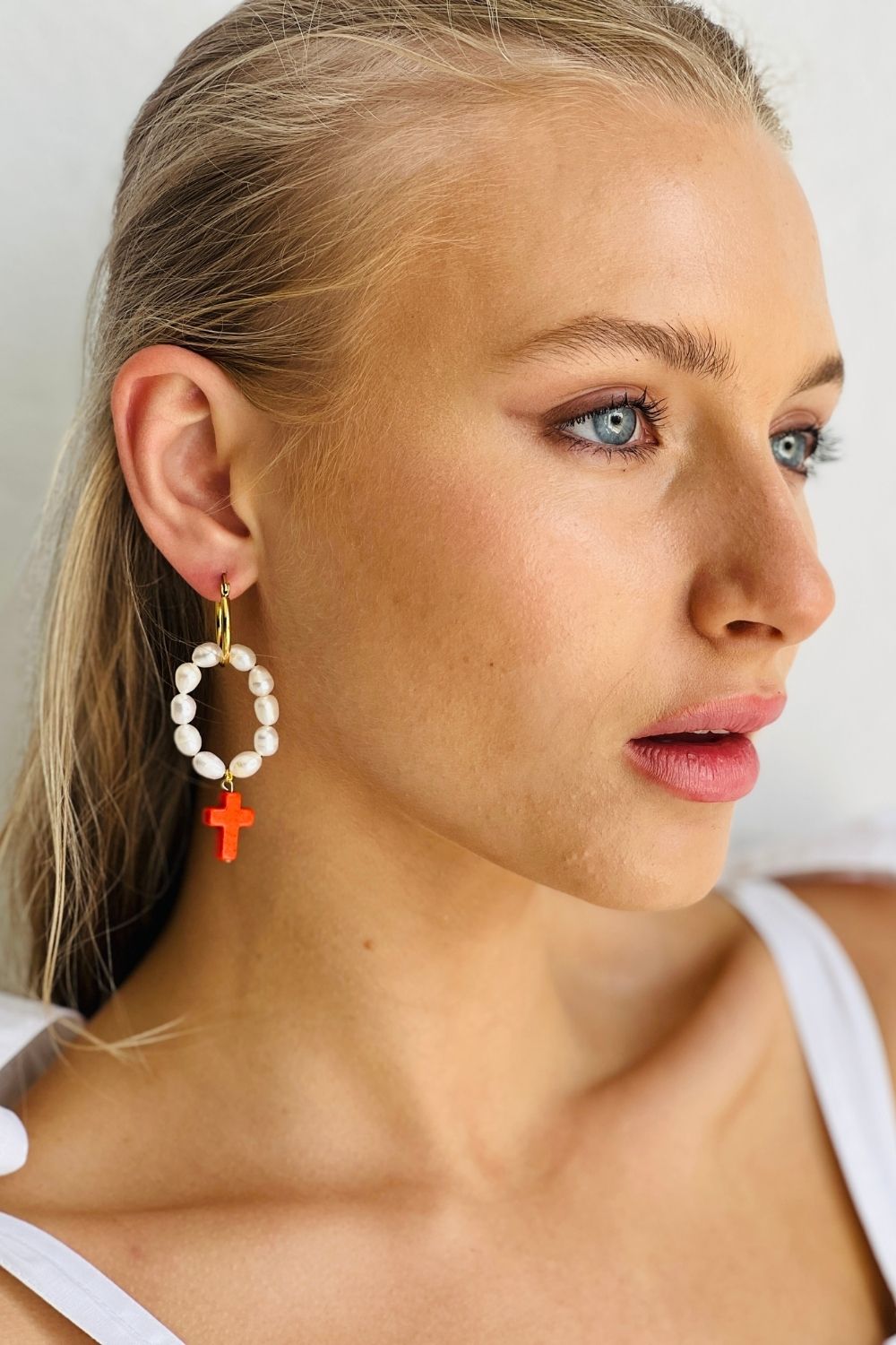 Drop pearl hoops with Red Coral Cross